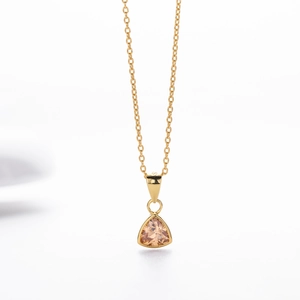 Detailed macro view of S925 sterling silver stamp on champagne triangle pendant necklace
