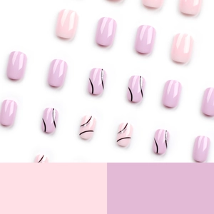 Short square press-on nails in lavender and pink with minimalist wavy black lines and glitter