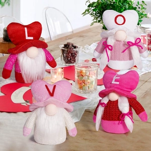 Detail of four Valentine's Day gnomes with LOVE letters in a festive home setting
