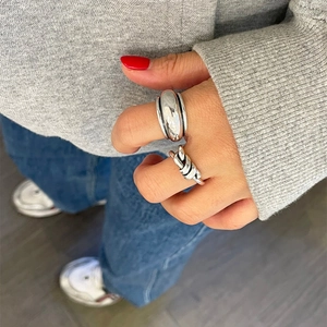 Modern 925 sterling silver set featuring a chunky band and a knot ring worn on hand