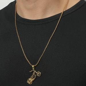 Golden punk motorcycle skull pendant necklace with box chain shown on model