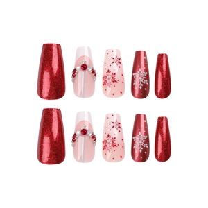 Christmas snowflake press-on nails set in long coffin shape with red glitter and rhinestones