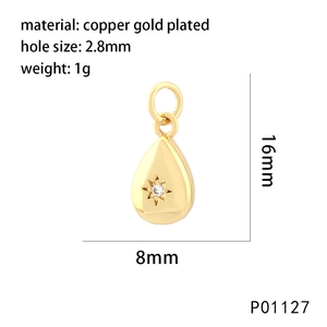 Macro shot of 18K gold plated teardrop charm with zircon inlay and product measurements
