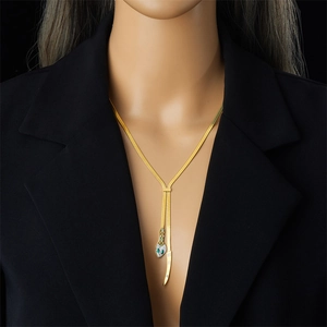 Gold stainless steel snake necklace with crystal-encrusted snake head on a female model