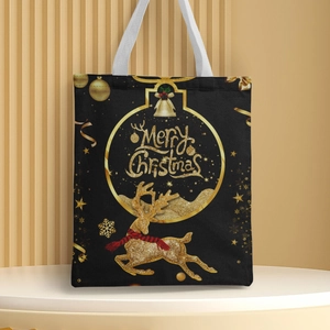Detail of black canvas tote bag with golden Merry Christmas reindeer and bell prints