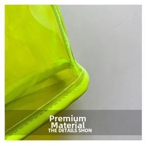 Macro detail of neon yellow transparent PVC travel bag featuring neat stitching seams