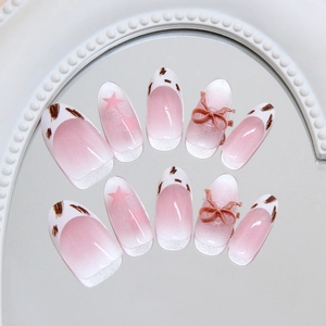 Pink cat eye almond press-on nails with leopard patterns and 3D bows decor