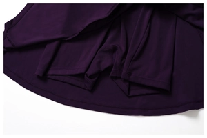 Detailed view of dark purple tennis skort with built-in safety shorts and high elastic fabric
