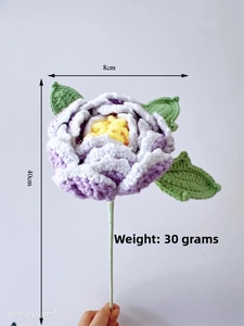 Detail of hand-crocheted purple peony flower with green leaves and 40cm stem length