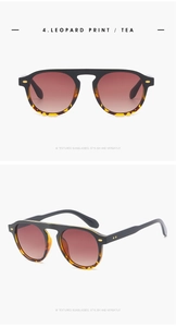 Detail view of leopard print sunglasses with golden studs and tea gradient lenses