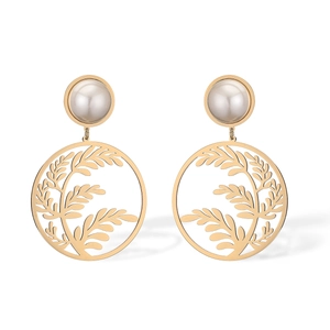 Fashionable gold-plated leaf earrings with round pearl accents in a geometric drop style