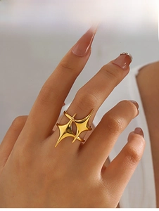 Close-up of dual four-pointed star crossover ring in 18K gold plated stainless steel