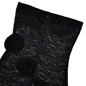 Detail of black sheer lace bodysuit featuring textured 3D floral accents and elegant patterns