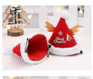 Detail of plush Christmas hair clips with reindeer antlers and festive tree decorations