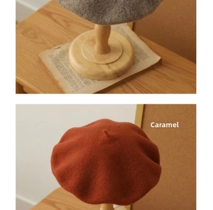 Detailed texture of gray and caramel wool blend beret hats on wooden display stands