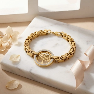 Detail of gold Tree of Life bracelet with pavé crystal settings and square chain link