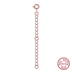 Detailed macro view of S925 sterling silver rose gold extender chain and spring clasp