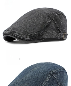 Detail of washed denim ivy caps in black and navy with adjustable metal buckles