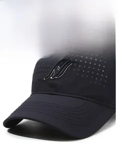 Detail of breathable laser-cut mesh holes and 3D embroidered logo on black baseball cap