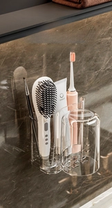 Close-up of wall-mounted transparent bathroom organizer with multi-compartment storage