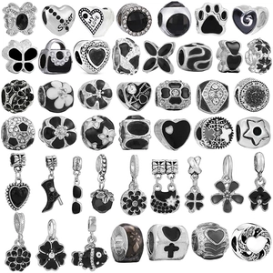 Silver and black alloy DIY charms collection with floral, heart, and star patterns