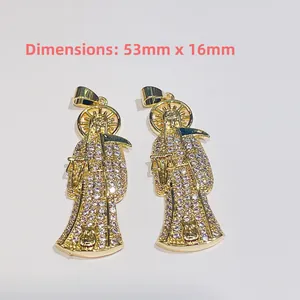 Detailed view of Santa Muerte pendants featuring gold-plated copper and cubic zirconia micro-inlay