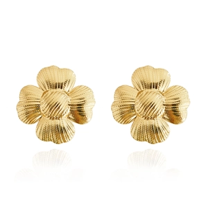 Detailed macro view of 18K gold ginkgo leaf stud earrings with fine textured metal finish