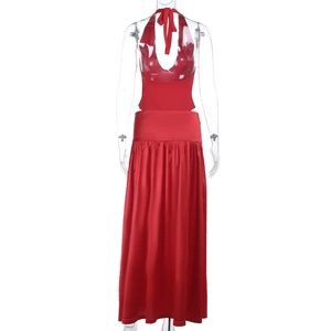 Detail of red halter backless maxi dress with silky glossy fabric on a mannequin