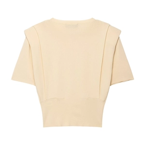 Detail of cream short sleeve knit top showing shoulder pads and ribbed hem waist
