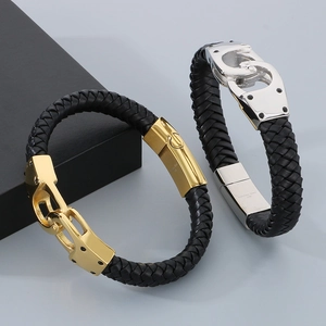 Detail of 316L stainless steel handcuff clasp on black braided leather men's bracelet