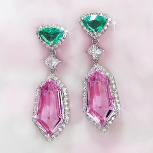 Three-tier pink crystal drop earrings with 3A zircon and green accent on pink background