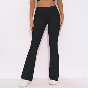 Detail of high waisted flared yoga pants featuring tummy control and elastic breathable fabric