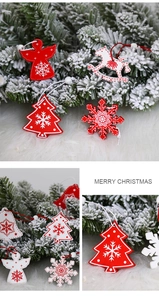 Detail of red and white painted wooden Christmas ornaments with snowflake patterns