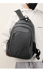 Detail view of water-resistant black laptop backpack with multi-compartment functional design