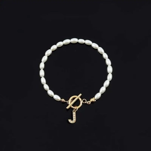 Elegant white pearl bracelet with gold OT toggle clasp and rhinestone letter J pendant