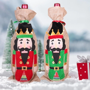 Nutcracker soldier Christmas wine bottle covers in red and green festive linen fabric
