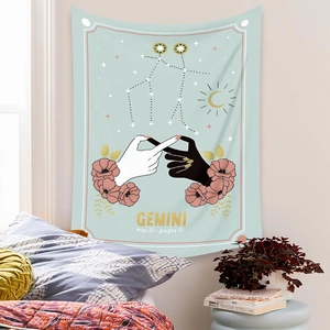 Close-up of Gemini zodiac wall tapestry in mint green with celestial star patterns