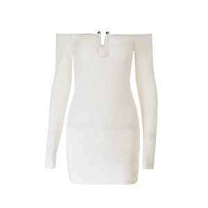 Detailed view of white off-the-shoulder dress featuring embossed 3D texture and bead accent