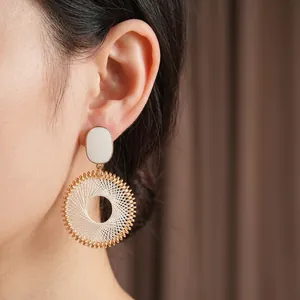 Retro round woven drop earrings with white mesh pattern and gold metal frame for women