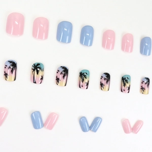 Press-on nail set featuring pastel pink, blue, and sunset coconut tree nail art designs