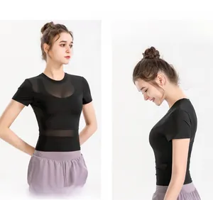 Detail of black slim fit yoga top featuring breathable mesh panels and short sleeves