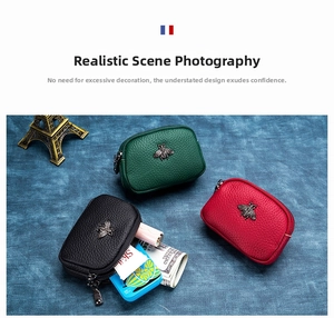 Three leather coin purses with bee hardware showing internal capacity for cards and lipstick