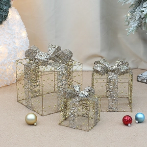 Three-piece glowing Christmas gift boxes with gold metal wire and pearl decorations