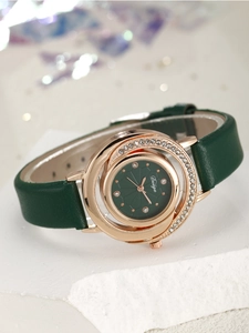 Macro detail of luxury rose gold watch with green textured dial and crystal bezel