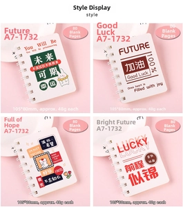 Detailed view of four A7 mini spiral notebooks featuring diverse motivational cover designs