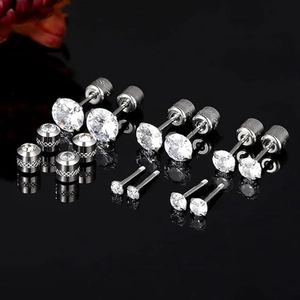 Macro shot of multiple sizes of clear round cubic zirconia stud earrings with screw backs