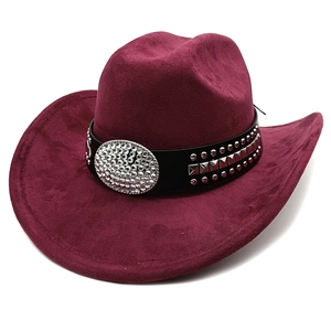 Detail of burgundy western cowboy hat featuring a leather band with rhinestone buckle