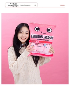 Detailed view of pink snack bag plush toy with mini rainbow axolotl dolls inside