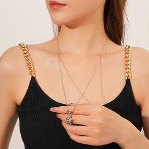 Silver chain necklace with starry resin heart pendant worn by model in professional studio