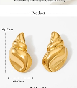 Polished gold conch shell earrings details with dimensions 33mm by 20mm in macro view